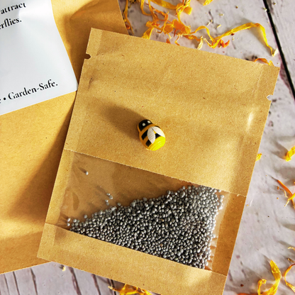 Plant Thyme beneficial insect/ladybug Sprinkles packaging with red clover seeds on a wooden surface with dried flowers for pollinator gardens