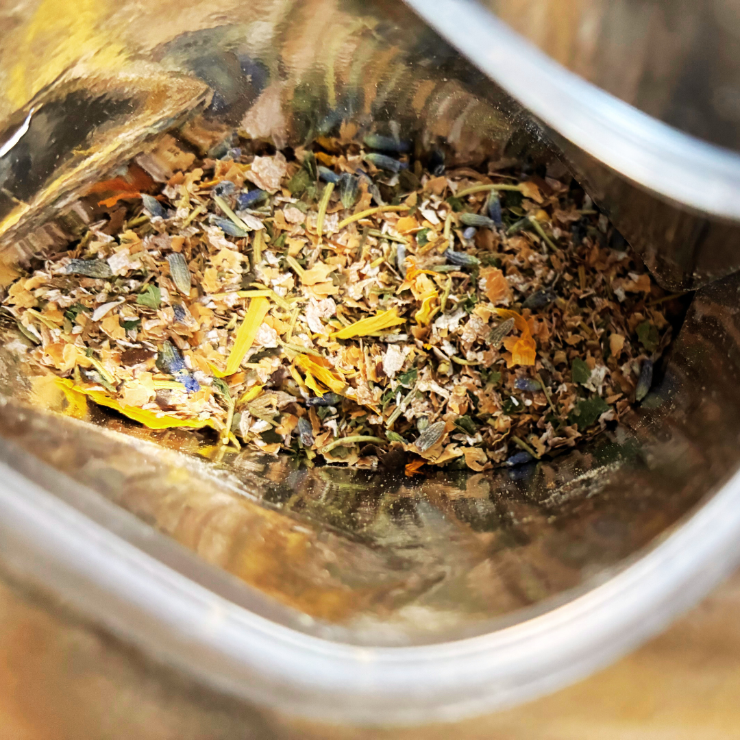 Plant Thyme Bee Banquet Sprinkles packaging with white cloverbee seeds on a wooden surface with dried flowers for pollinator gardens